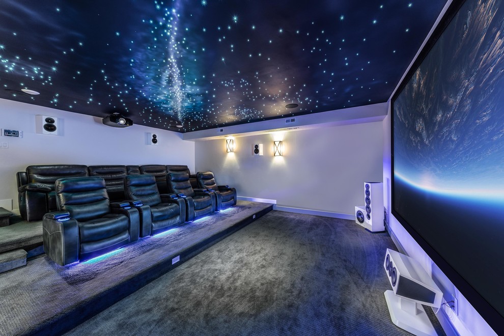 Large minimalist enclosed carpeted and gray floor home theater photo in Salt Lake City with white walls and a projector screen