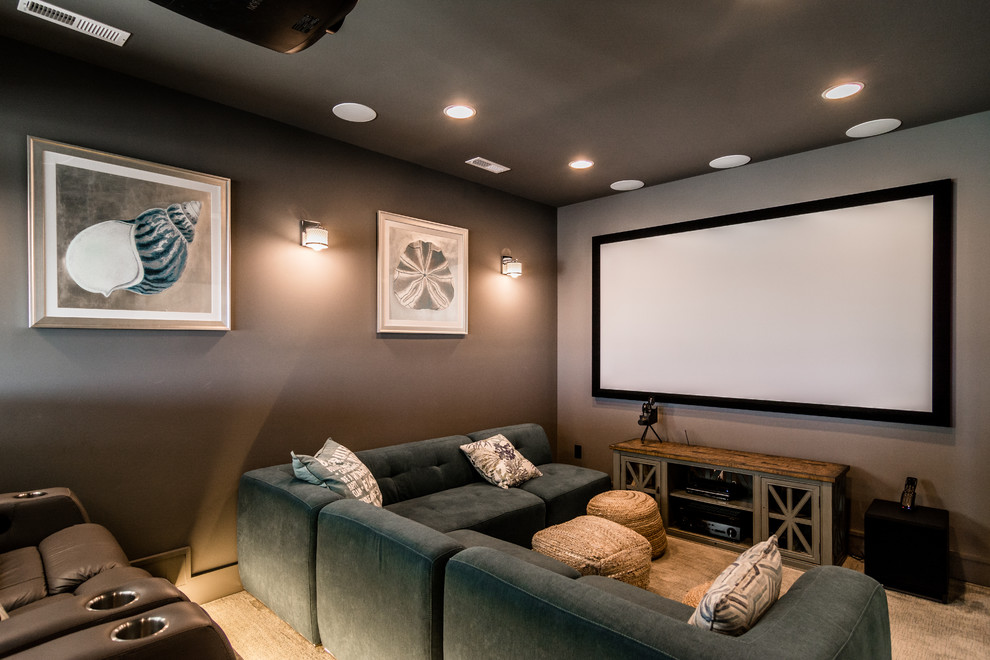 Home theater - large transitional enclosed carpeted and beige floor home theater idea in Other with beige walls and a projector screen