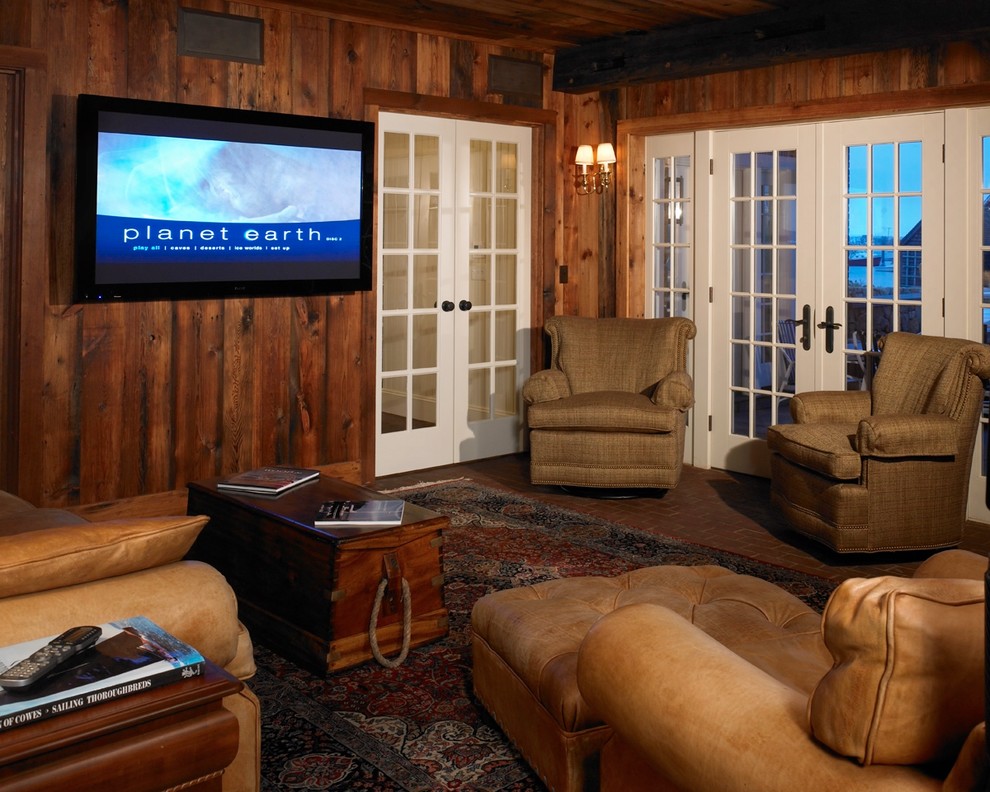 Inspiration for a mid-sized coastal enclosed brick floor home theater remodel in Boston with brown walls and a wall-mounted tv