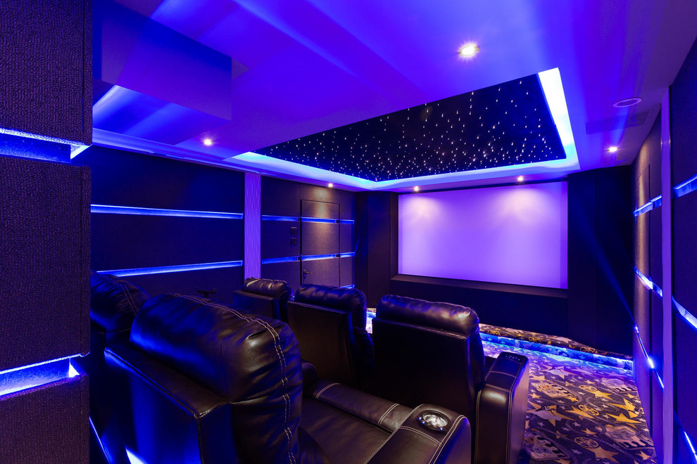 Small minimalist enclosed carpeted and blue floor home theater photo in DC Metro with black walls and a projector screen
