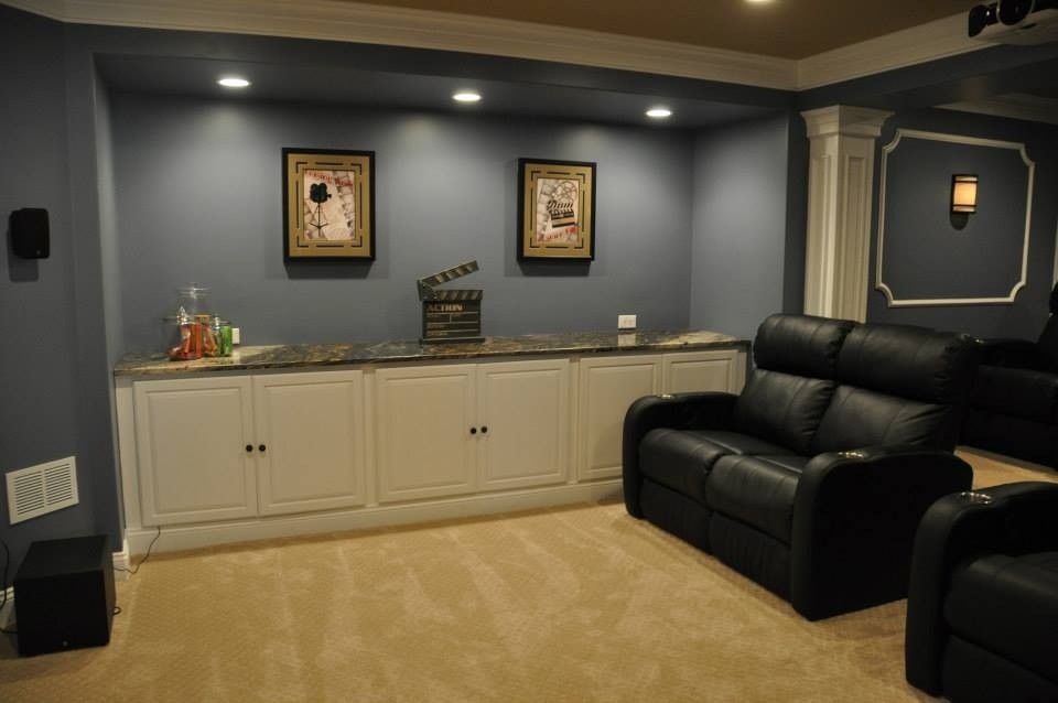 Inspiration for a mid-sized timeless enclosed carpeted and beige floor home theater remodel in Philadelphia with blue walls and a projector screen