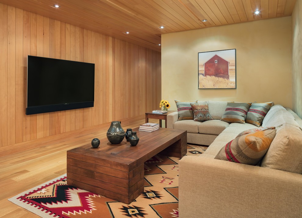 This is an example of a medium sized modern open plan home cinema in Other with brown walls, medium hardwood flooring, a wall mounted tv and brown floors.