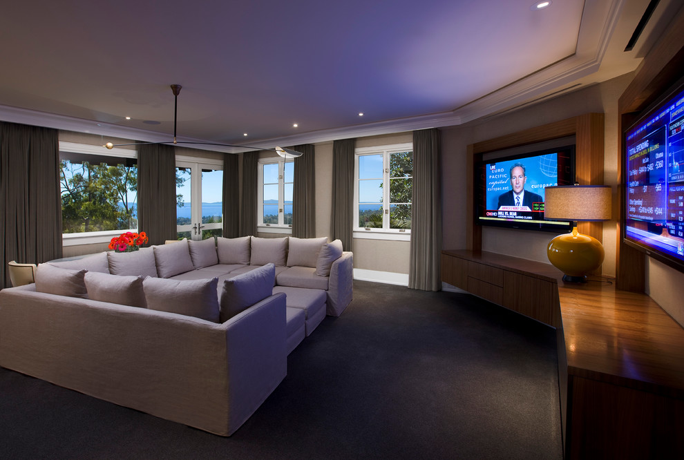 Inspiration for a contemporary home cinema in Santa Barbara with grey floors.