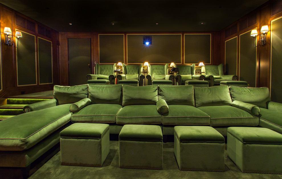 Large traditional enclosed home cinema in Los Angeles with beige walls, carpet and a projector screen.