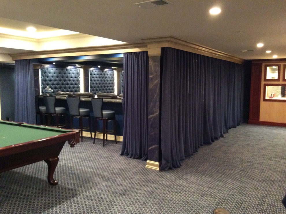 Example of a large transitional carpeted home theater design in New York with blue walls and a projector screen