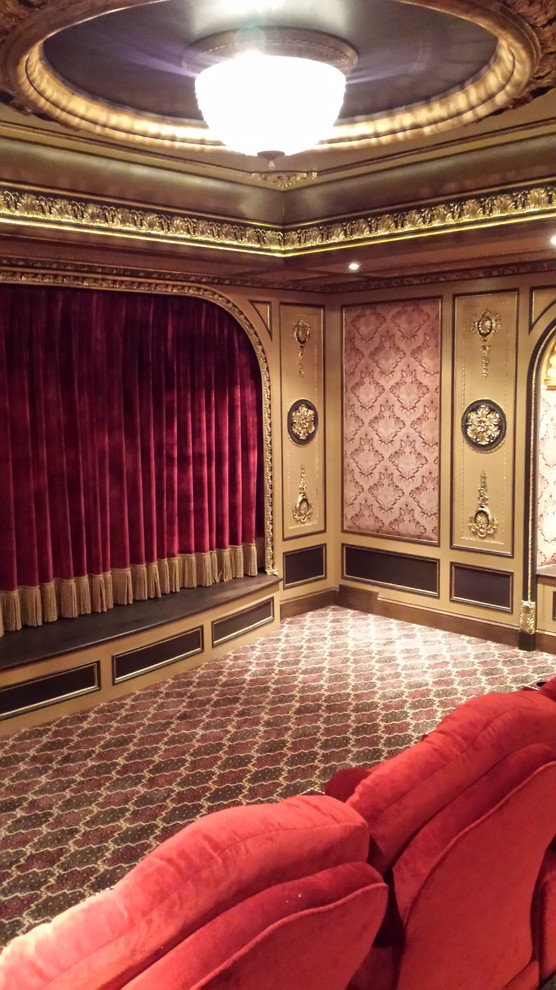 Home theater - large victorian enclosed carpeted home theater idea in New York with multicolored walls