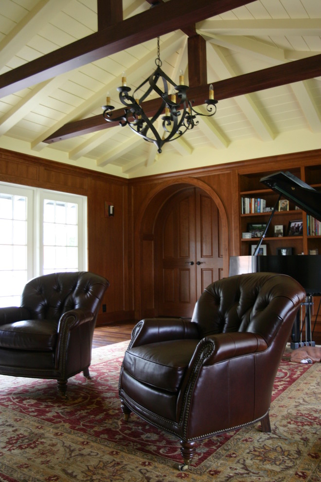 Traditional enclosed home cinema in San Francisco with brown walls and dark hardwood flooring.