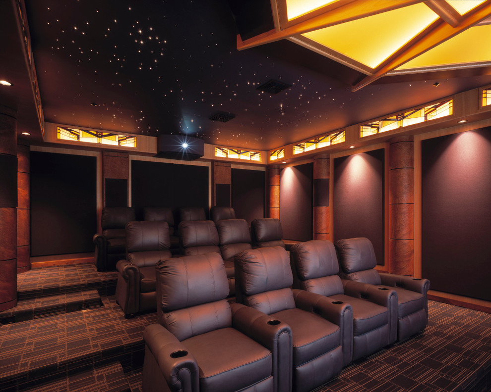 Example of a large enclosed carpeted and multicolored floor home theater design in St Louis with brown walls and a projector screen