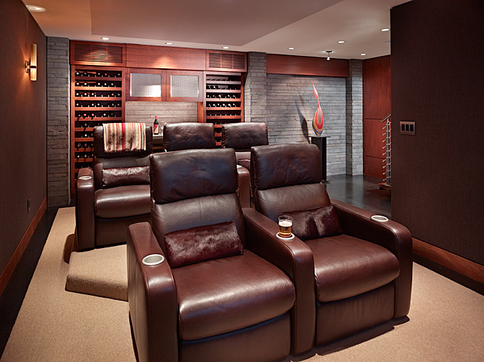 Example of a trendy brown floor home theater design in Seattle
