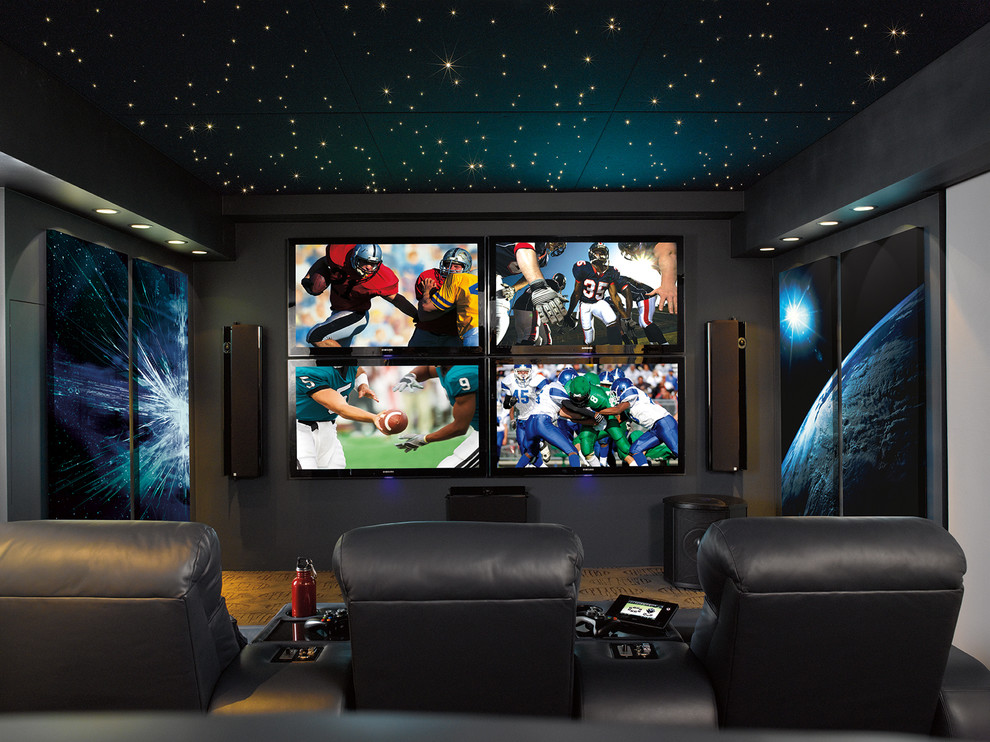 Imagen de cine en casa cerrado contemporáneo de tamaño medio con paredes grises, suelo de ladrillo y televisor colgado en la pared