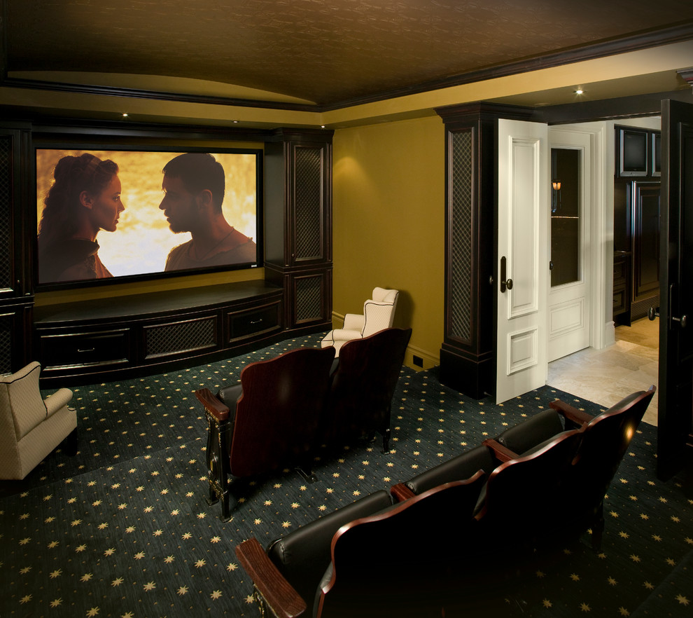 Inspiration for a large classic enclosed home cinema in Calgary with beige walls, carpet and a wall mounted tv.