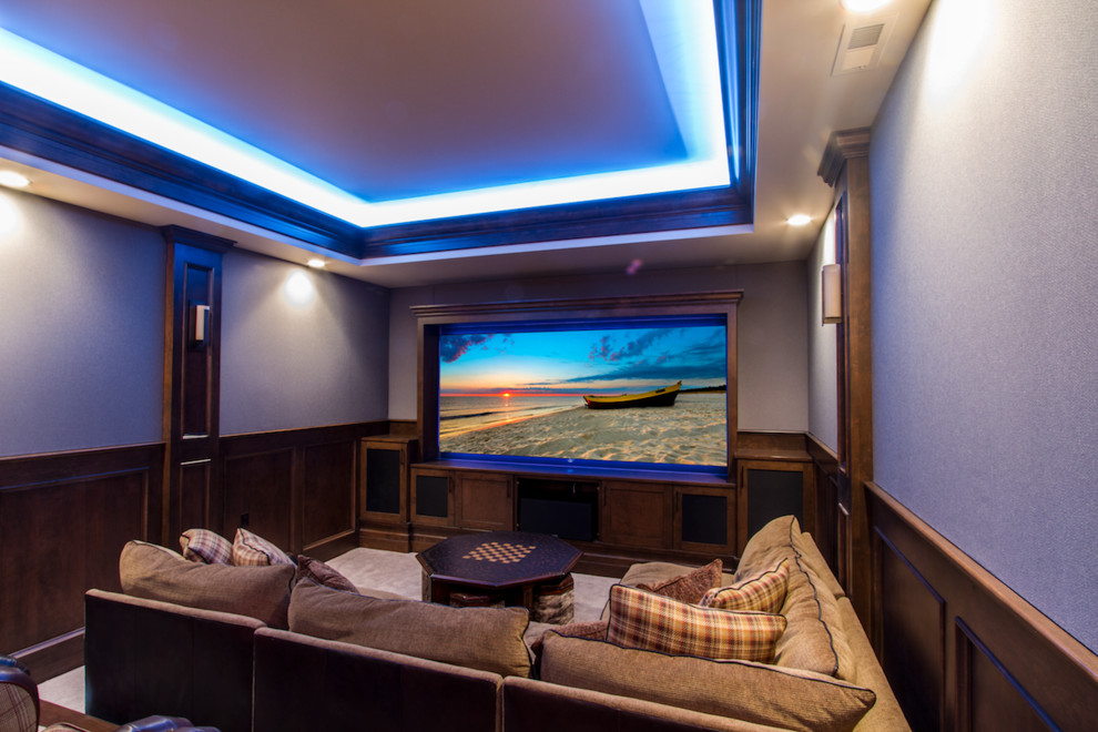 Inspiration for a large rustic open concept carpeted and white floor home theater remodel in Denver with a projector screen and blue walls