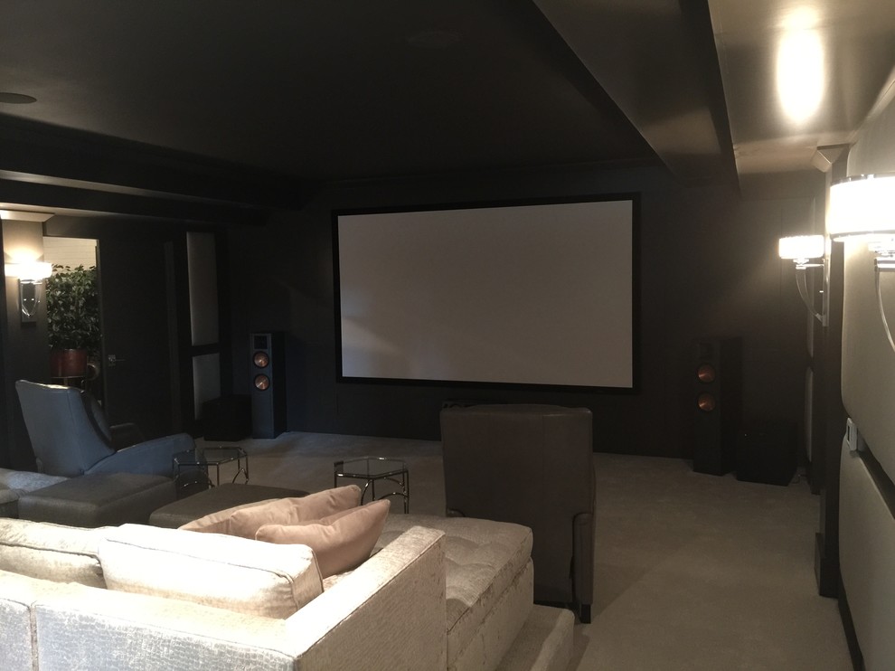 Large elegant enclosed carpeted home theater photo in Other with gray walls and a projector screen