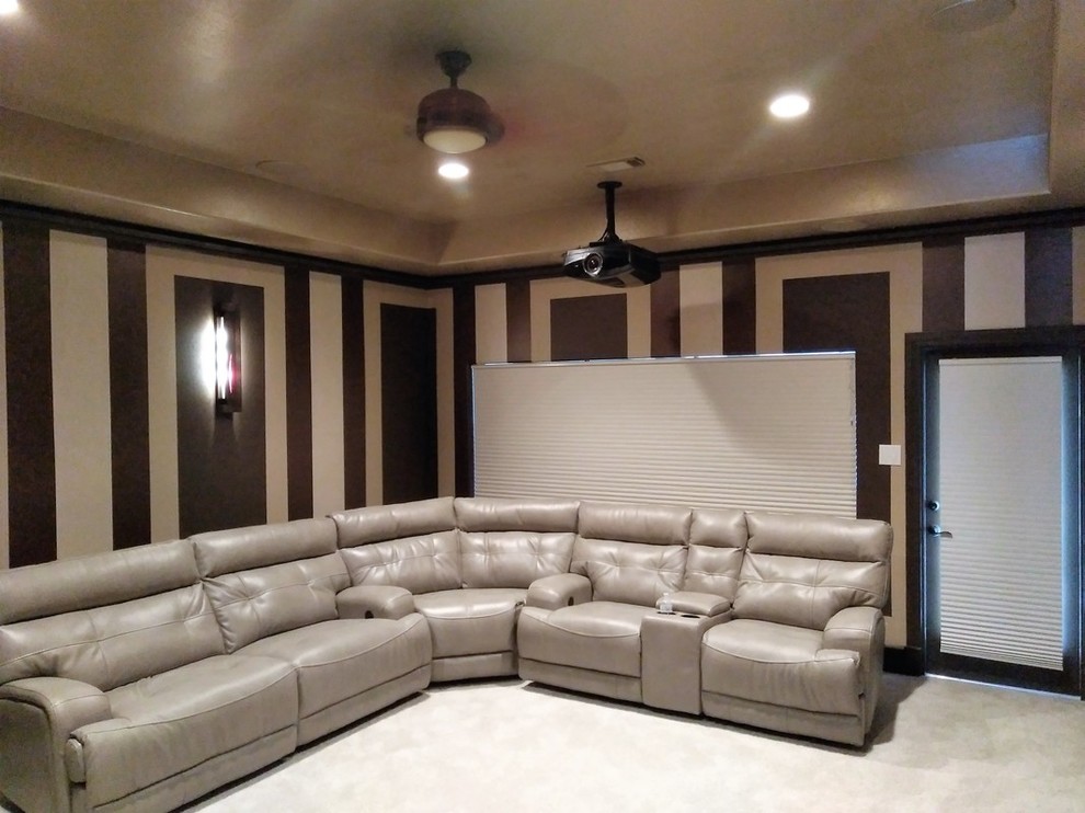 Mid-sized minimalist enclosed home theater photo in Houston with a projector screen