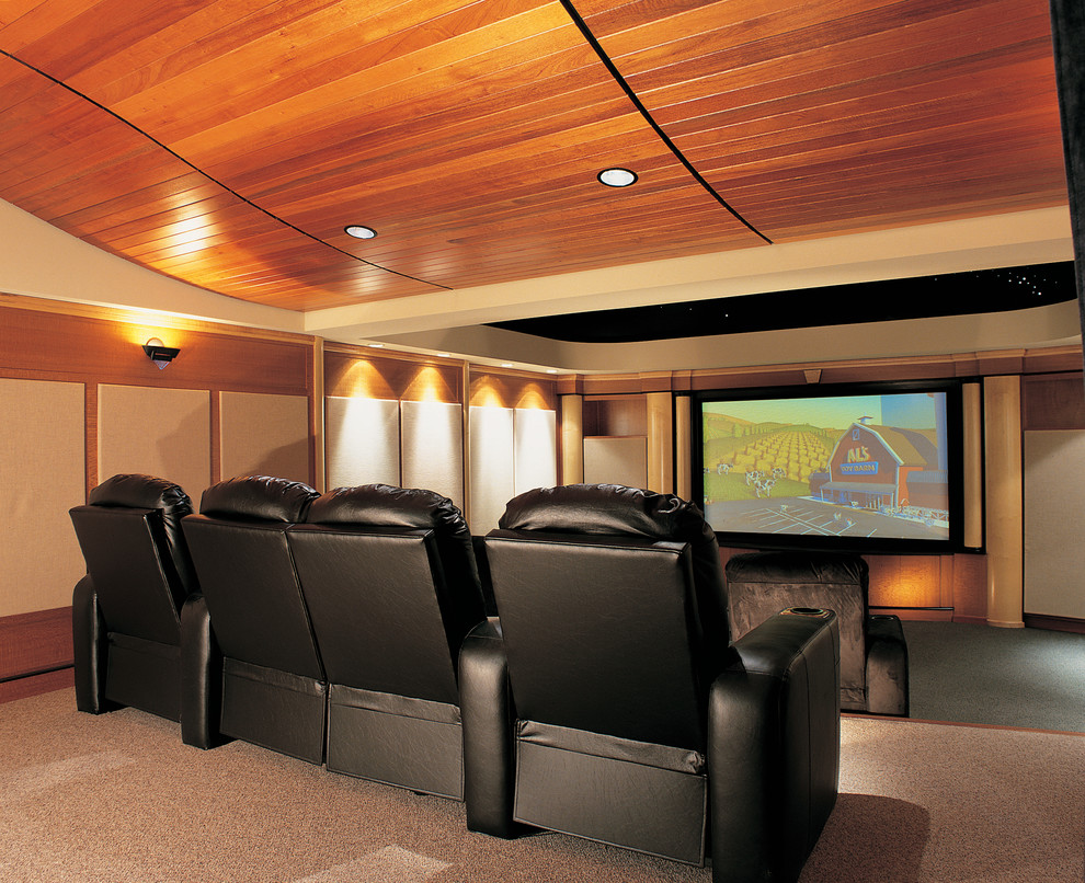 Home theater - large traditional enclosed carpeted home theater idea in Philadelphia with beige walls and a media wall
