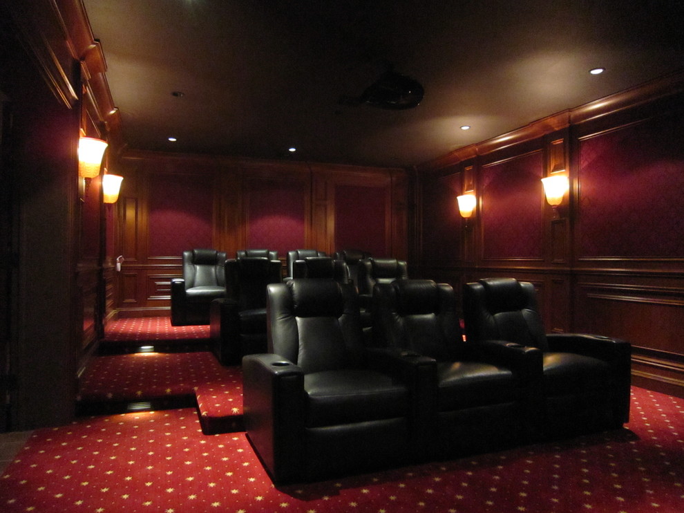 Example of a trendy multicolored floor home theater design in New York