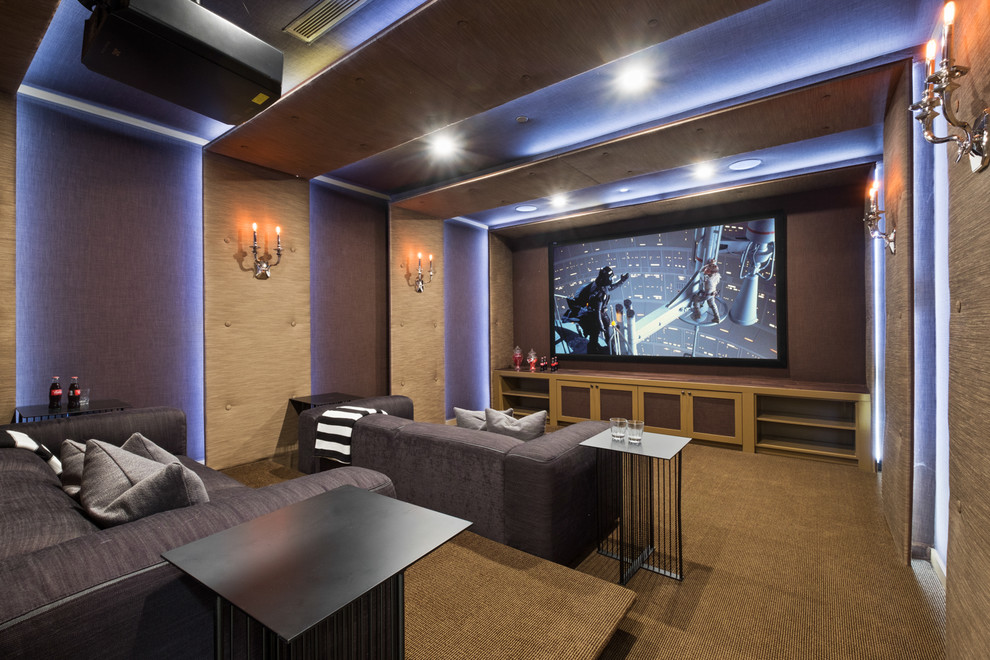 Home theater - transitional enclosed carpeted home theater idea in Los Angeles with a projector screen