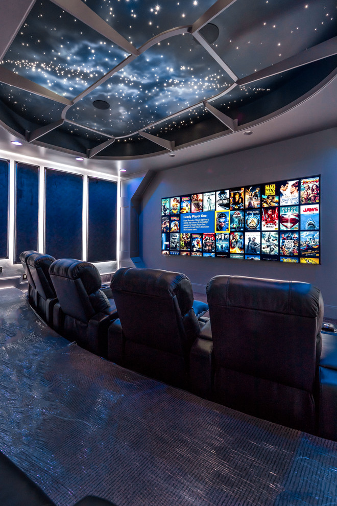 Home theater - large transitional open concept carpeted and gray floor home theater idea in Salt Lake City with gray walls and a media wall