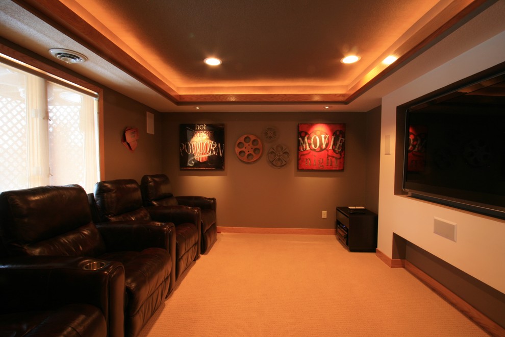 Inspiration for a mid-sized transitional enclosed carpeted home theater remodel in Minneapolis with green walls and a wall-mounted tv