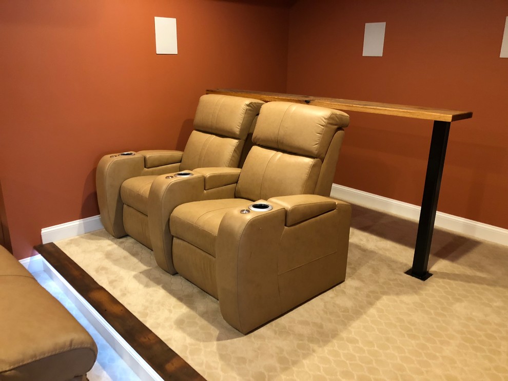 Example of a mid-sized classic enclosed carpeted and beige floor home theater design in DC Metro with orange walls and a projector screen