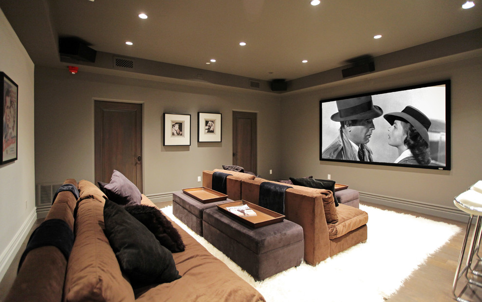 Inspiration for a mediterranean enclosed carpeted and beige floor home theater remodel in Los Angeles with gray walls