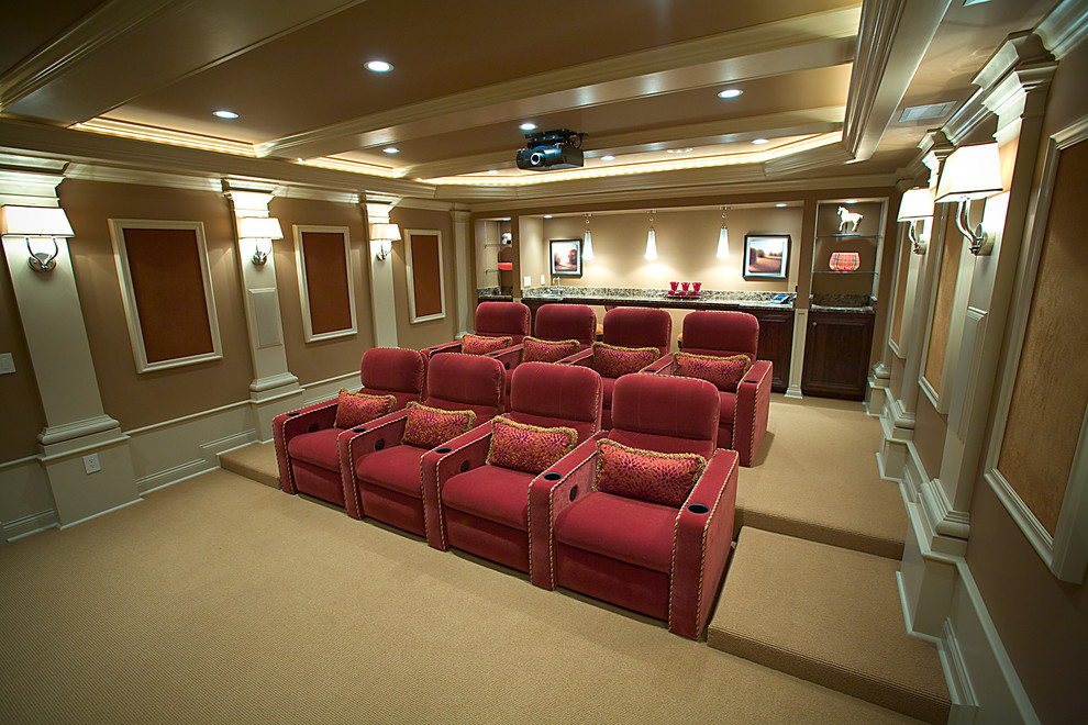 Large classic enclosed home cinema in Grand Rapids with brown walls, carpet and a projector screen.
