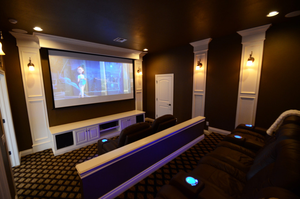 Home theater - large traditional enclosed carpeted home theater idea in Oklahoma City with brown walls and a projector screen