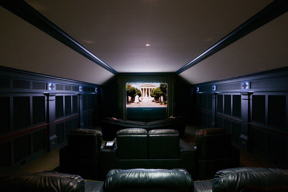 Large traditional enclosed home cinema in Boston with brown walls and a projector screen.