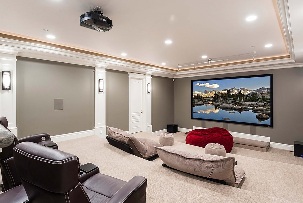 This is an example of a large classic enclosed home cinema in Salt Lake City with beige walls, carpet, a projector screen and beige floors.