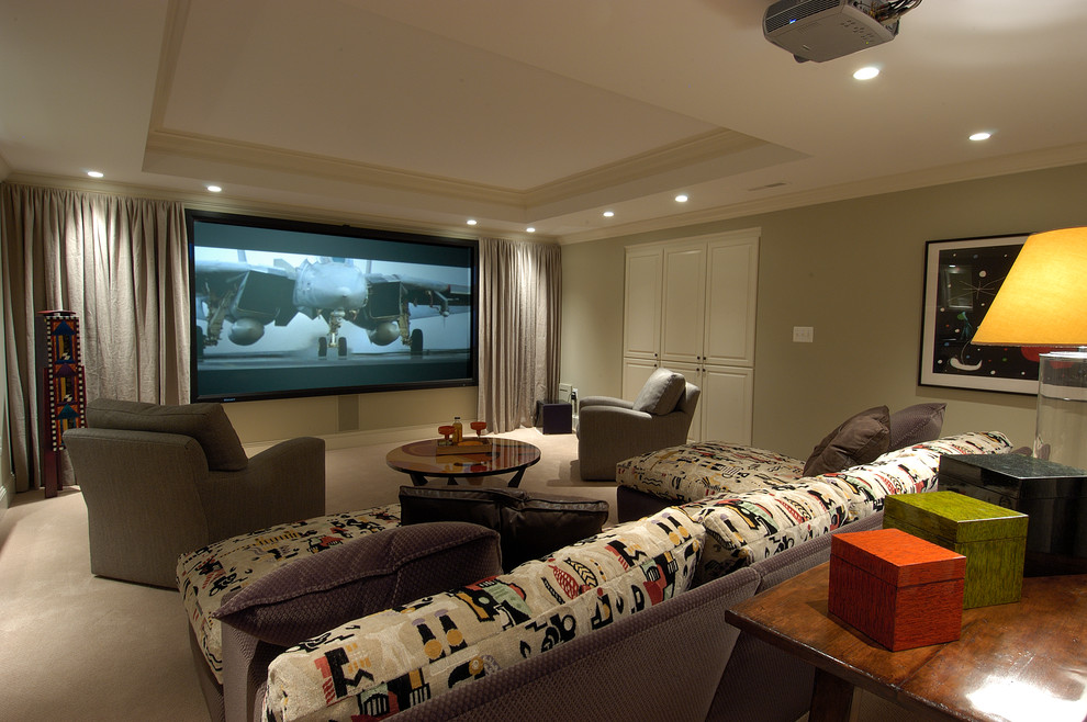 Inspiration for a large contemporary enclosed home cinema in DC Metro with green walls, carpet and a projector screen.