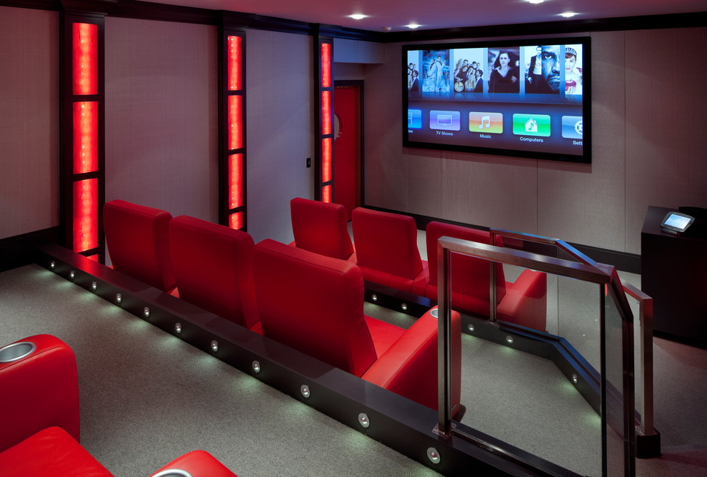 Home theater - contemporary enclosed home theater idea in Boston with a wall-mounted tv