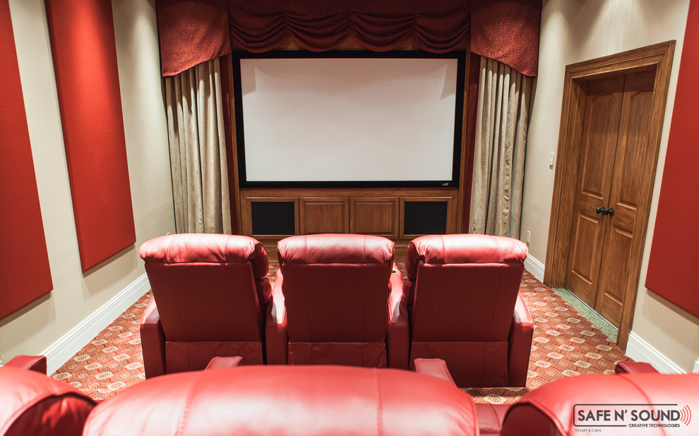 Home theater - mid-sized traditional enclosed carpeted home theater idea in Other with beige walls and a projector screen