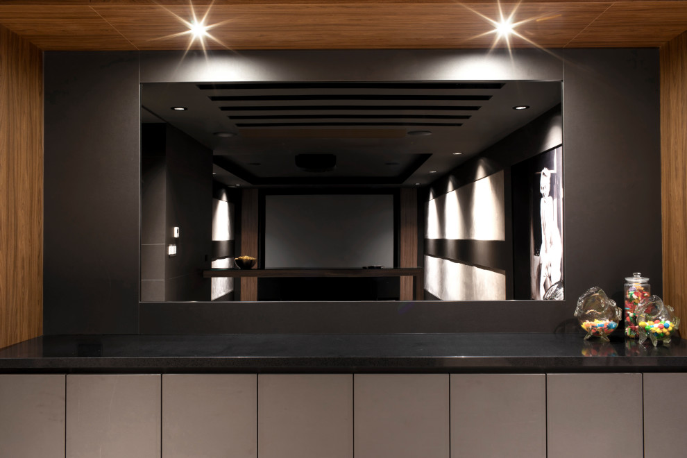 Design ideas for a large contemporary enclosed home cinema in Toronto with grey walls, concrete flooring, a projector screen and grey floors.