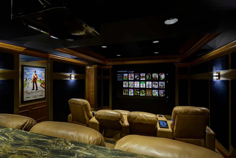Small elegant enclosed carpeted home theater photo in St Louis with beige walls and a projector screen