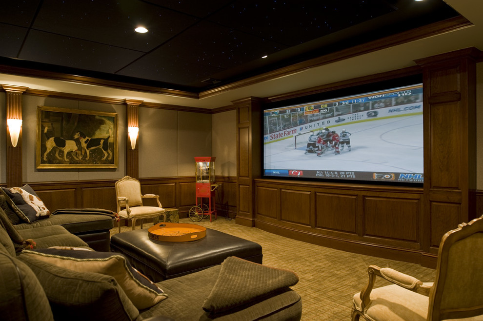 Home theater - huge traditional open concept carpeted and green floor home theater idea in Philadelphia with beige walls and a media wall