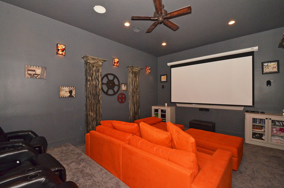 Home theater - mid-sized transitional enclosed carpeted and beige floor home theater idea in Houston with gray walls and a projector screen