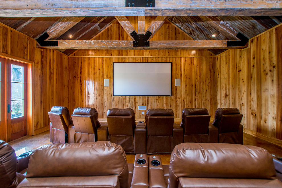Home theater - huge rustic home theater idea in New Orleans