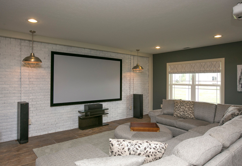 Design ideas for a traditional home cinema in Columbus with green walls and dark hardwood flooring.