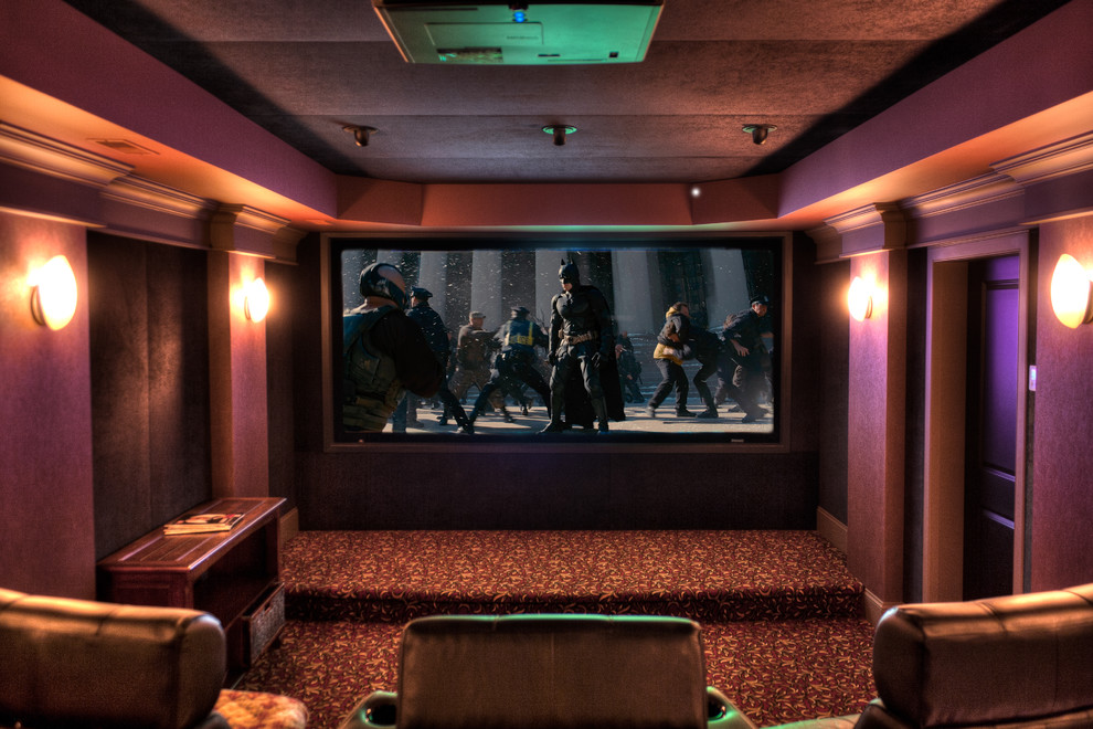 Small elegant enclosed carpeted home theater photo in Vancouver with red walls and a projector screen
