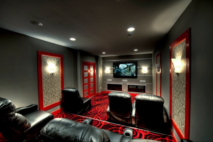 Inspiration for a mid-sized contemporary enclosed carpeted home theater remodel in DC Metro with gray walls and a media wall
