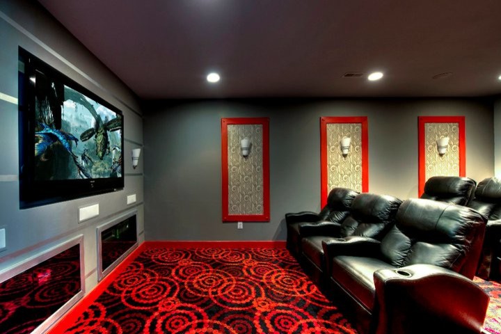 Mid-sized trendy enclosed carpeted home theater photo in DC Metro with gray walls and a media wall