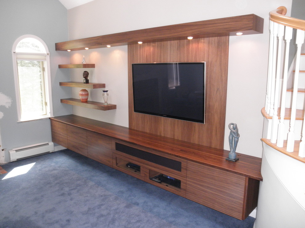 Example of a mid-sized trendy enclosed carpeted home theater design in Boston with white walls and a wall-mounted tv