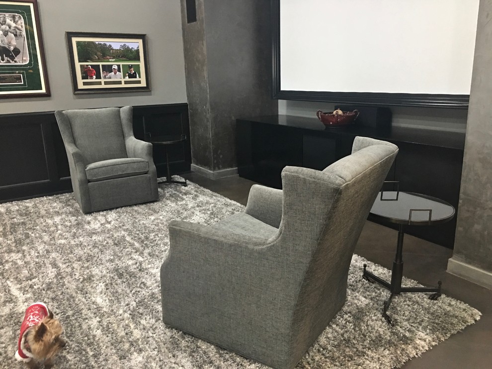 This is an example of a large classic enclosed home cinema in Dallas with grey walls, concrete flooring, a projector screen and black floors.
