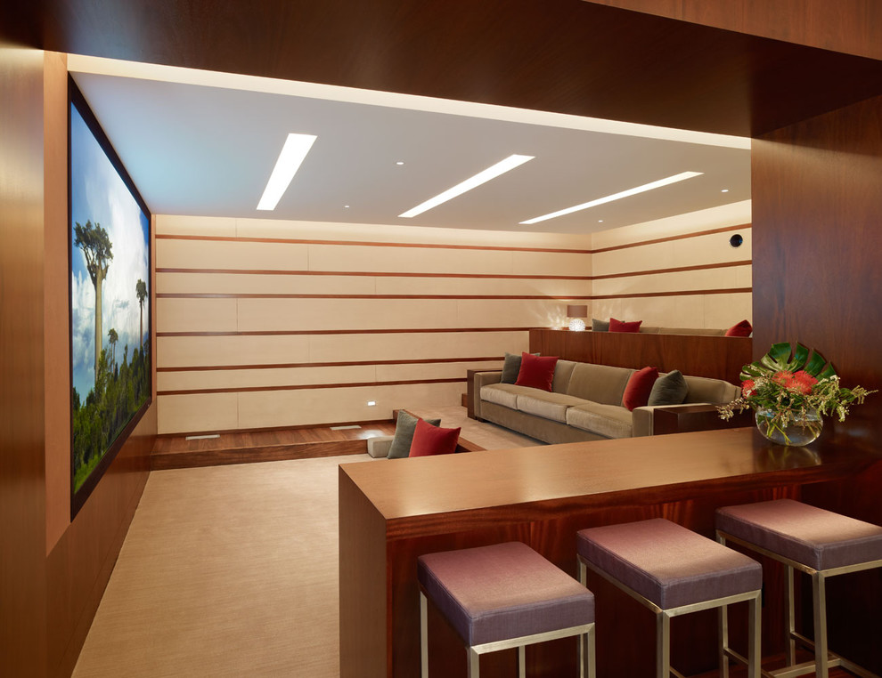 Trendy enclosed home theater photo in Los Angeles with a projector screen