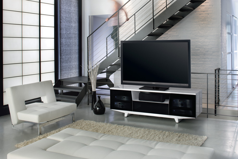 Home theater - large modern open concept home theater idea in Other with white walls