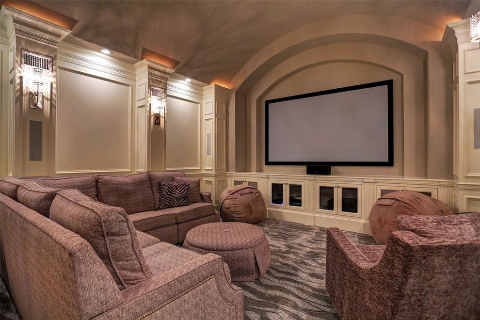 Design ideas for a large mediterranean enclosed home cinema in Houston with beige walls, carpet, a projector screen and multi-coloured floors.