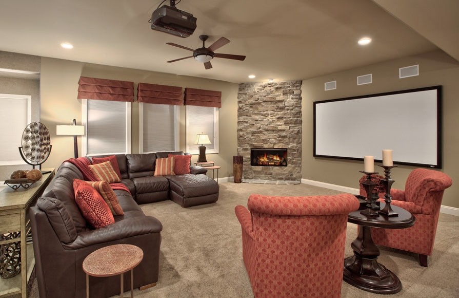 Home theater - huge traditional open concept carpeted home theater idea in Omaha with brown walls and a projector screen