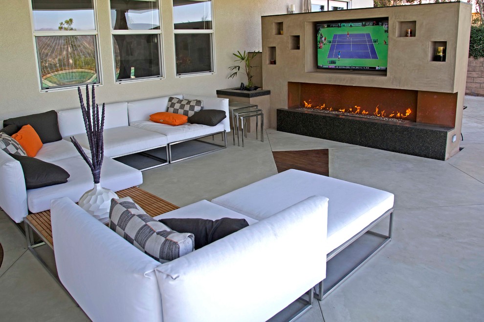 Inspiration for a mid-sized timeless open concept concrete floor home theater remodel in Los Angeles with a wall-mounted tv