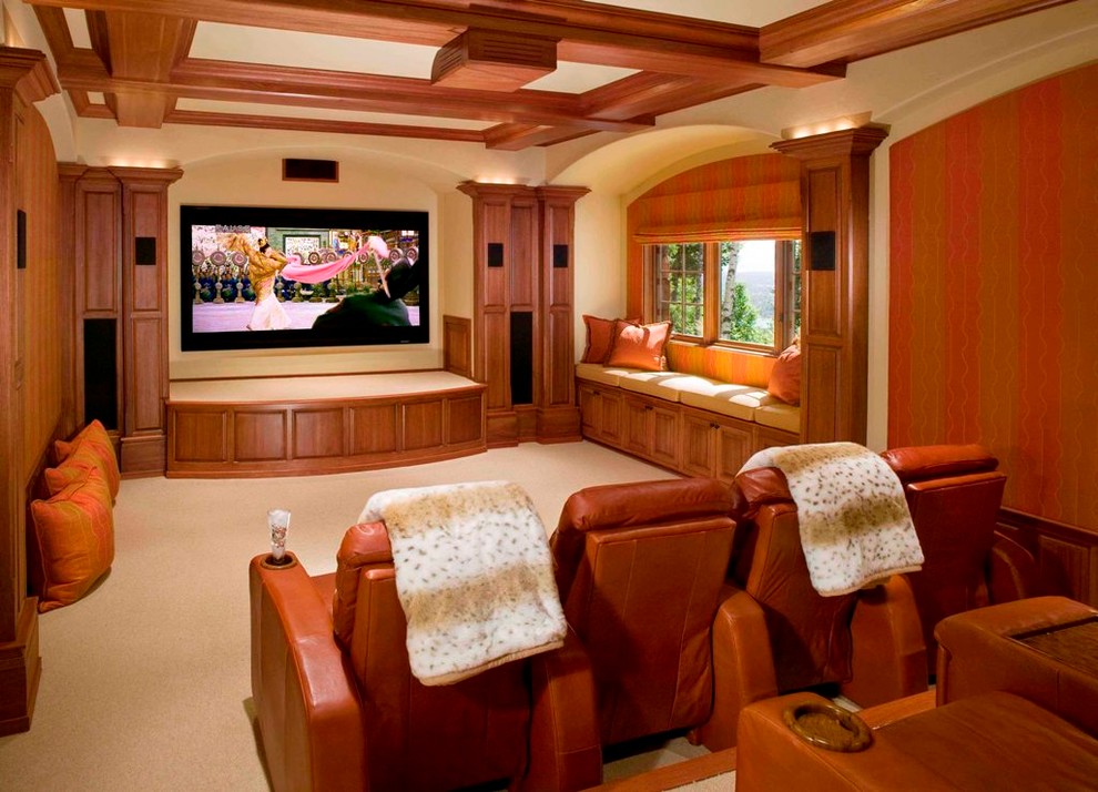 Large elegant enclosed carpeted and beige floor home theater photo in Denver with beige walls and a projector screen