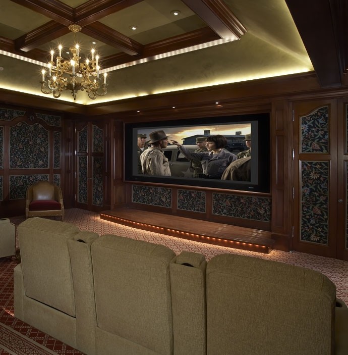 Inspiration for a medium sized mediterranean enclosed home cinema in San Diego with brown walls, carpet and a wall mounted tv.